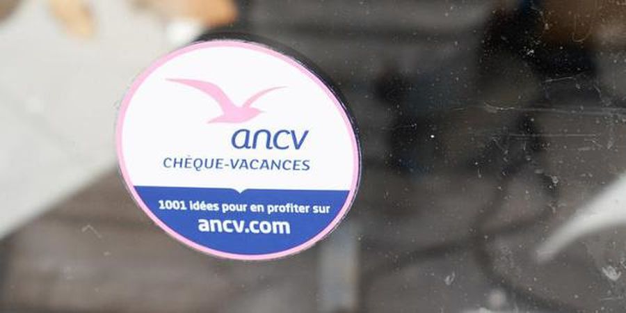 Bordeaux , Aquitaine France - 03 18 2021 : cheque vacances by ancv logo brand and text sign sticker on windows hotel restaurant french label holiday departure aid