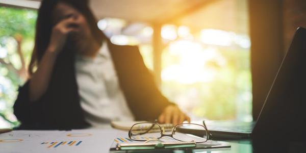 Businesswoman get stressed and headache while having a problem at work in office